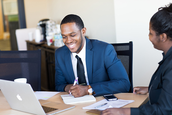 Jessy Dwyer in a suit, in an office