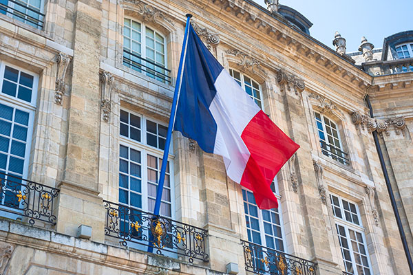 French flag displayed on building facade