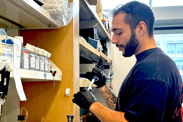 Giovanni Caricati working with lab equipment
