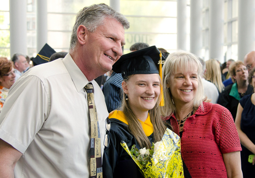 Parents and student at commencement