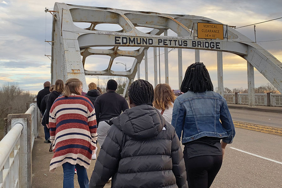 students crossing the Edmund Pettus Bridge