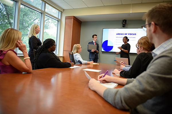 business presentation to a group in a conference room