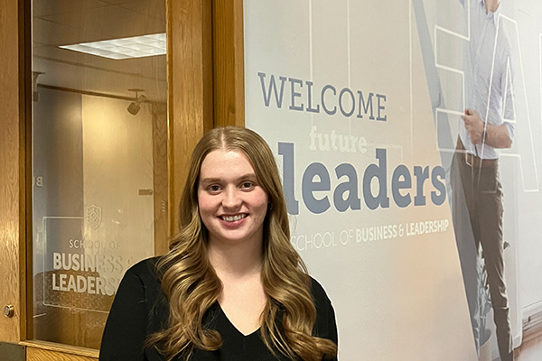 Emily Tyo poses in School of Business and Leadership, Nazareth University
