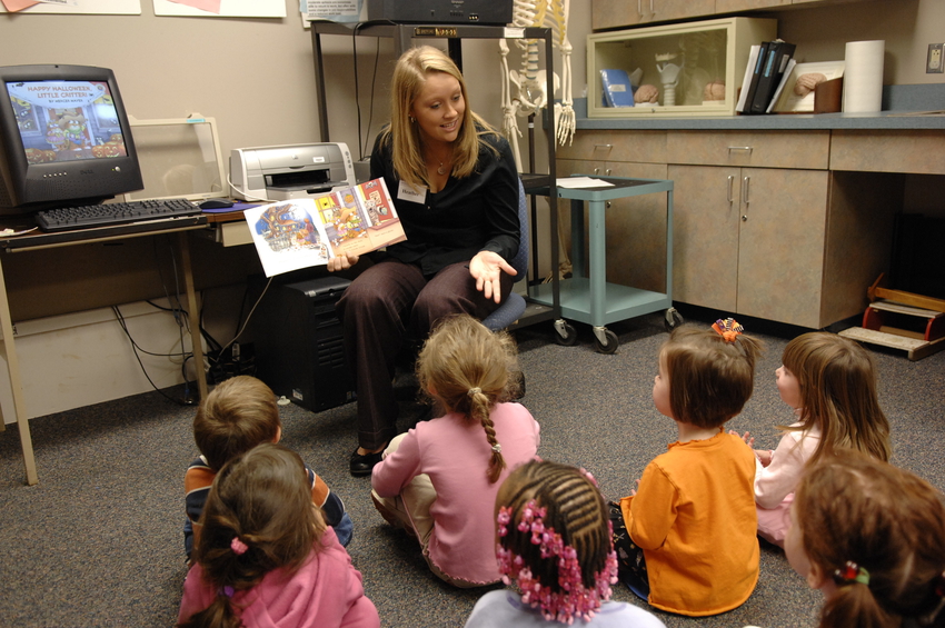 teacher reading to young children