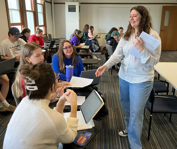 Danielle Alesi passes out info for small group history work