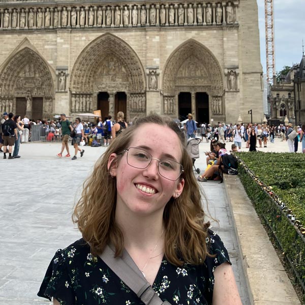 Laura Zehr, alum of the French language degree at Nazareth University, at a monument in France