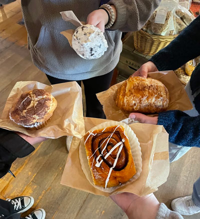 Students holding pastry and ice cream treats at Pittsford Dairy