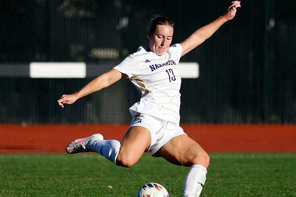 soccer player kicking ball