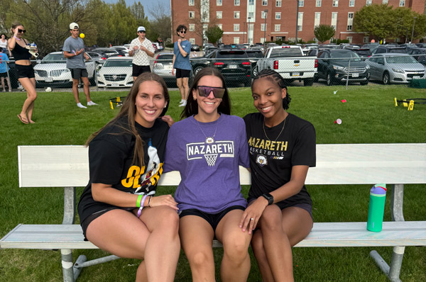 Kiara Anglin on a bench with friends
