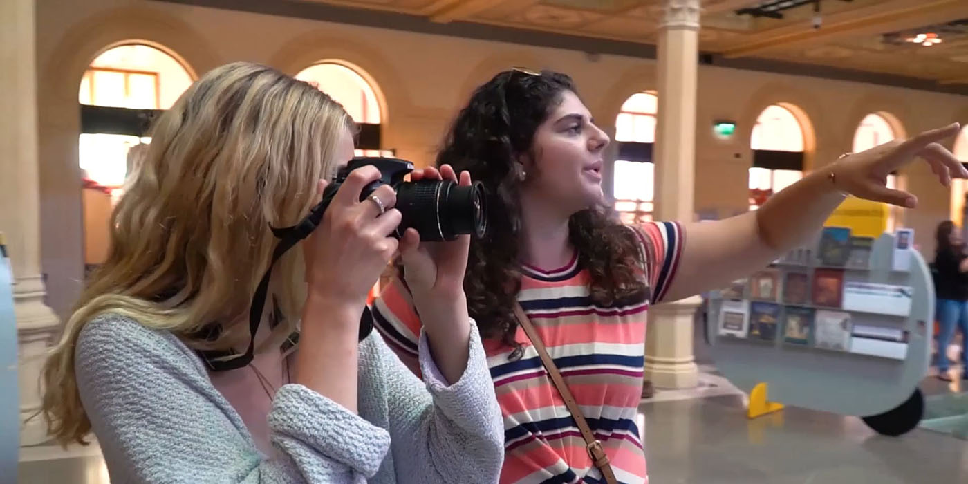 student photographers taking photos in a book store