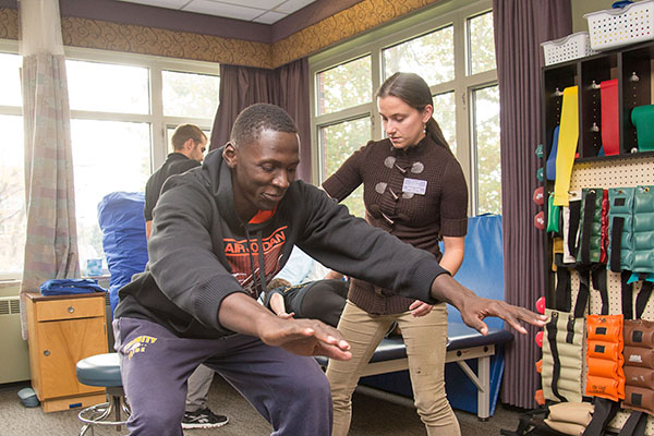 physical therapist working with an athlete