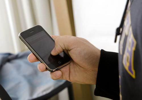 student with cell phone