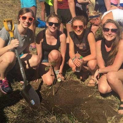 Jenna planting a tree in Costa Rica as a service to the community with fellow PT students from Naz